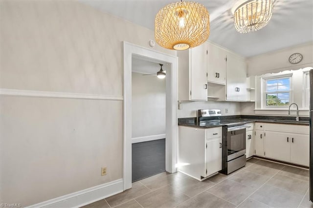 kitchen featuring sink, ceiling fan with notable chandelier, electric stove, and white cabinetry