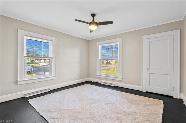 empty room with ornamental molding and ceiling fan