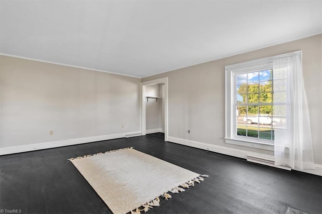 unfurnished room featuring dark hardwood / wood-style floors