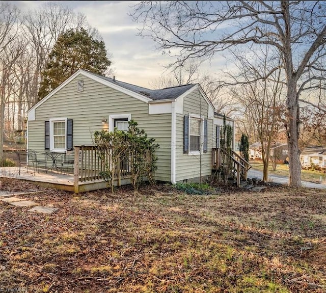 exterior space with crawl space and a deck