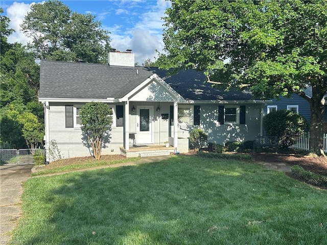 1327 Irving St, Winston-Salem, NC 27103 - ranch-style house featuring a chimney and a shingled roof