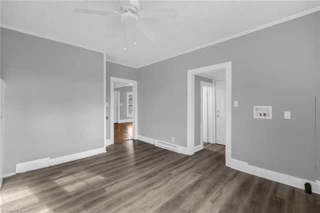 spare room with ornamental molding, dark hardwood / wood-style floors, and ceiling fan