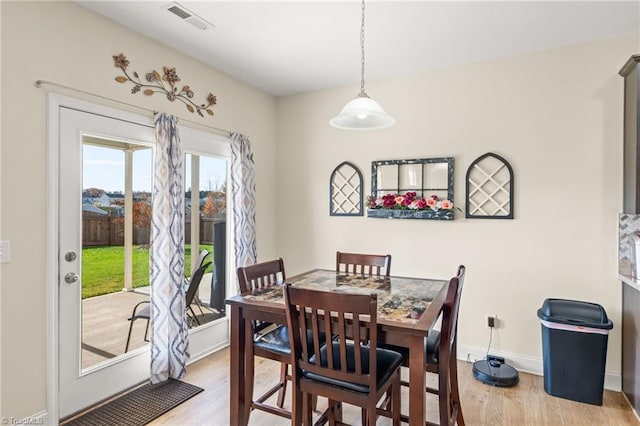 dining area with light hardwood / wood-style floors