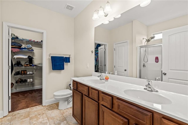 bathroom featuring vanity and an enclosed shower