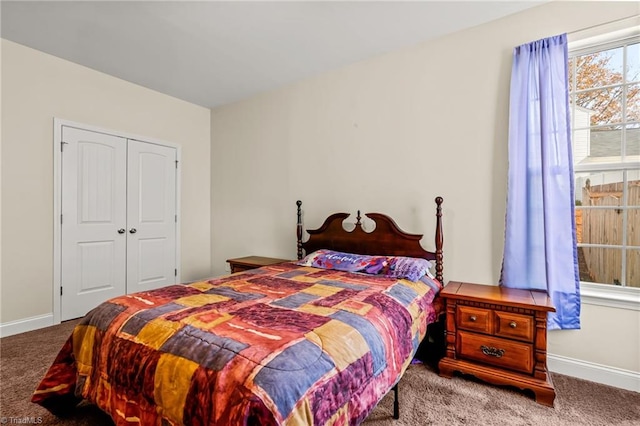 carpeted bedroom with a closet