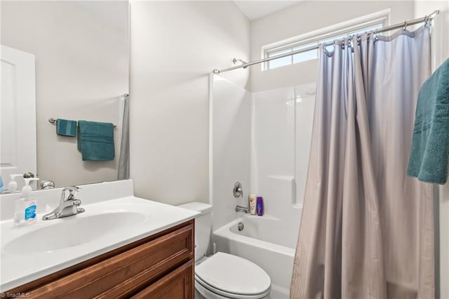 full bathroom featuring shower / bath combo, toilet, and vanity