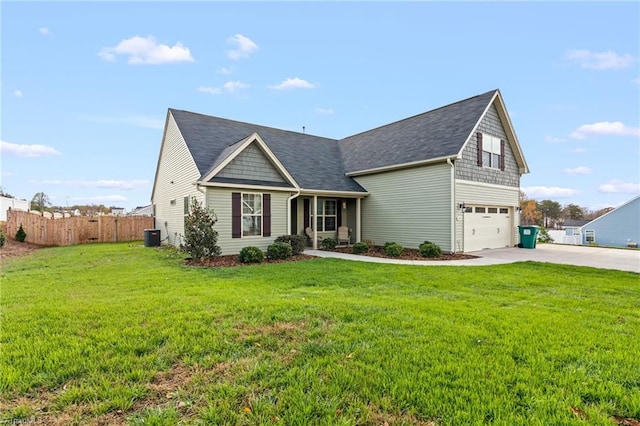 view of front of home featuring a front lawn and a garage