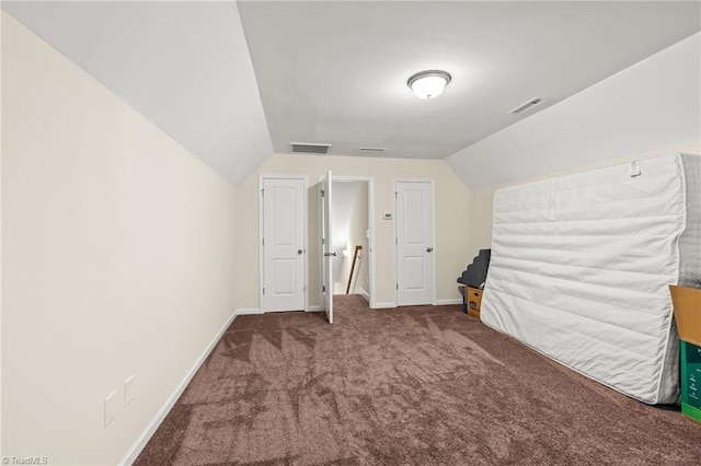 interior space featuring lofted ceiling and carpet floors