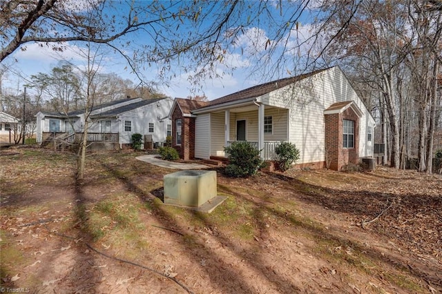 view of property exterior featuring covered porch