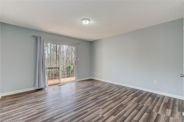 spare room with hardwood / wood-style floors