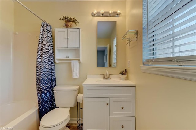 full bathroom featuring vanity, shower / bath combination with curtain, and toilet