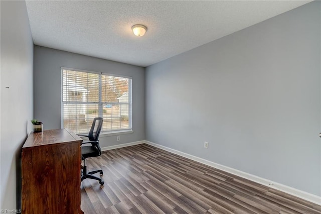 home office featuring a textured ceiling and light hardwood / wood-style flooring