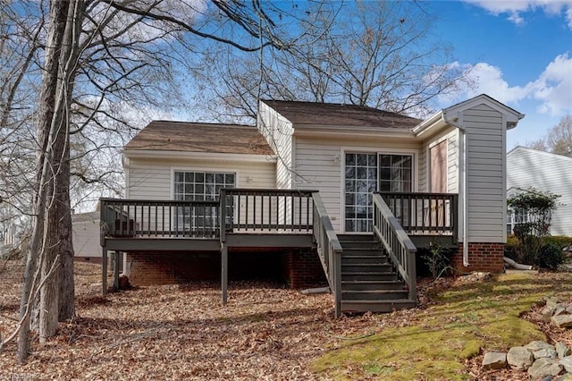 back of house featuring a deck