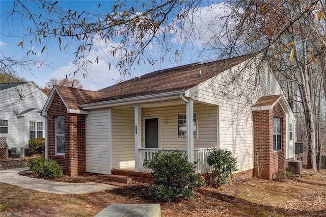 view of front of house featuring central AC unit and covered porch