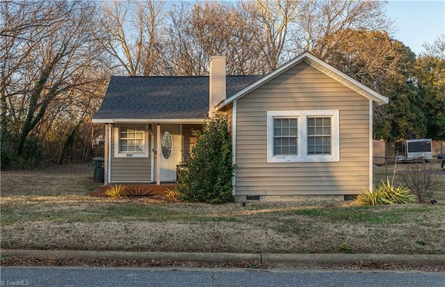 bungalow-style house with a front lawn