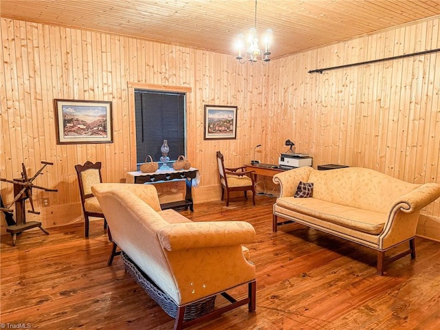 living room featuring wood ceiling, wood walls, hardwood / wood-style floors, and a chandelier