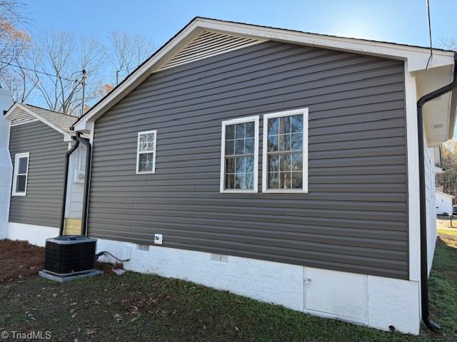 view of property exterior featuring central AC