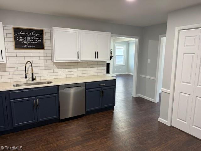 kitchen featuring dishwasher, white cabinets, sink, decorative backsplash, and dark hardwood / wood-style flooring