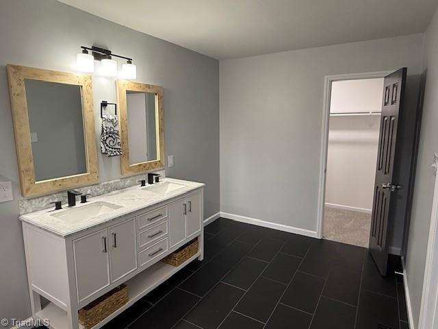 bathroom featuring tile patterned floors and vanity