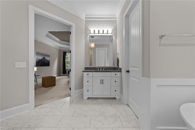 8441 Alice Player Dr, Oak Ridge, NC 27310 - bathroom featuring vanity, ornamental molding, marble look tile flooring, baseboards, and a freestanding bath