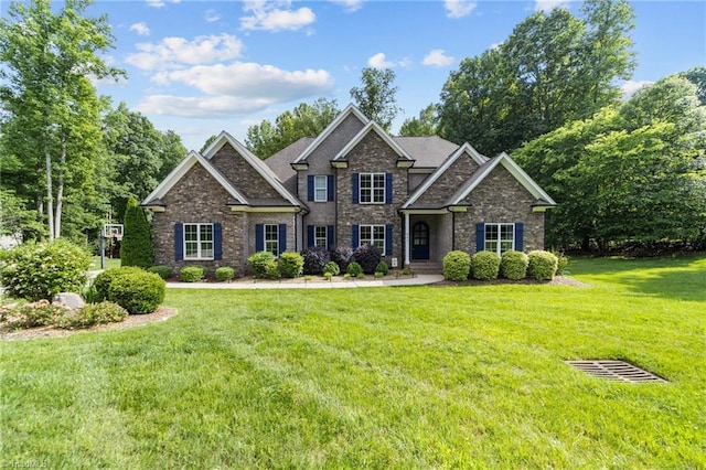 8441 Alice Player Dr, Oak Ridge, NC 27310 - craftsman-style home with a front yard and stone siding