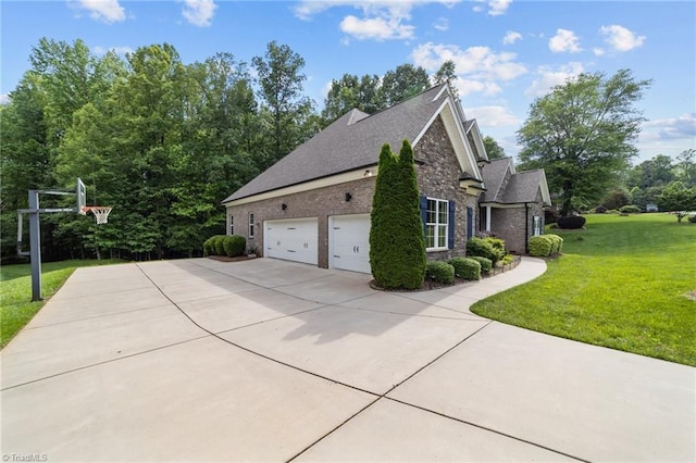 8441 Alice Player Dr, Oak Ridge, NC 27310 - view of side of home with concrete driveway, a yard, stone siding, and an attached garage