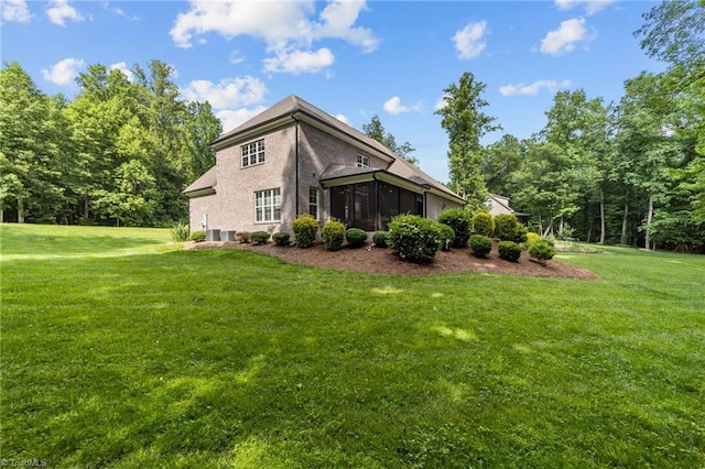 8441 Alice Player Dr, Oak Ridge, NC 27310 - back of house featuring a sunroom and a yard