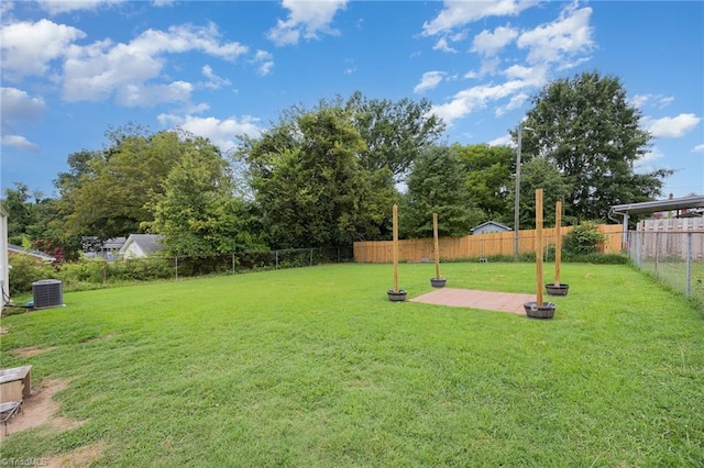 view of yard with a patio area and central air condition unit