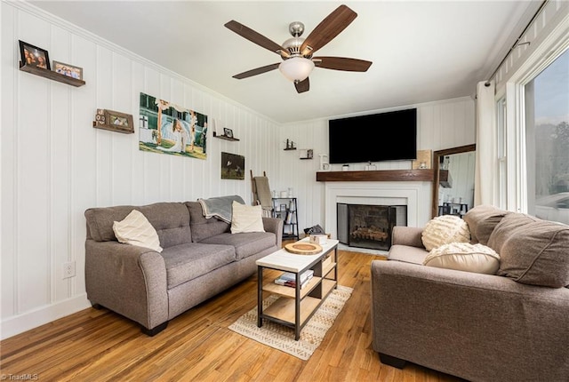 living room with hardwood / wood-style flooring and ceiling fan