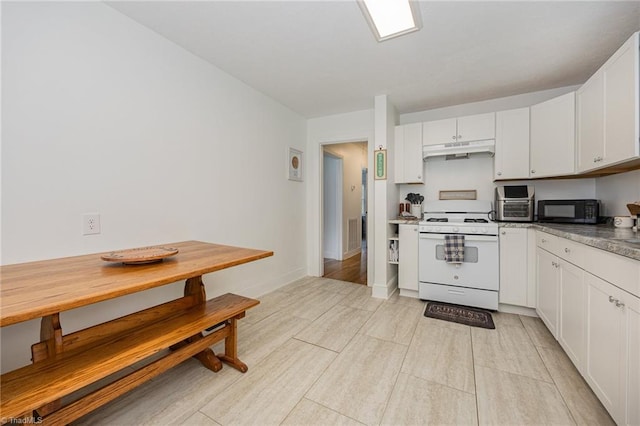 kitchen featuring light hardwood / wood-style flooring, white range oven, and white cabinets