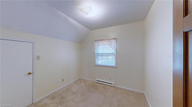 bonus room featuring a baseboard heating unit, baseboards, vaulted ceiling, and carpet