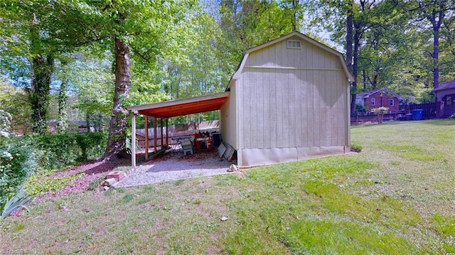 view of outbuilding with fence and an outbuilding