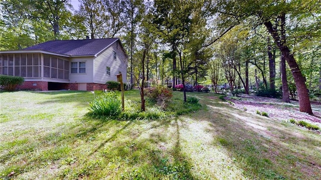 exterior space with a lawn and a sunroom