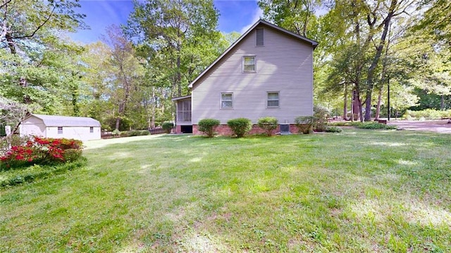 view of side of home featuring a yard and a sunroom