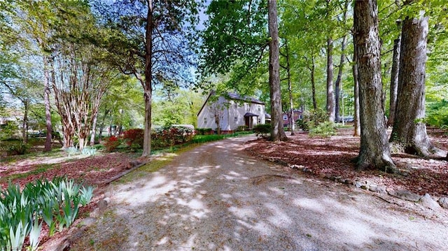 exterior space featuring driveway and a barn
