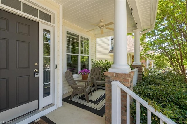 entrance to property featuring covered porch and a ceiling fan