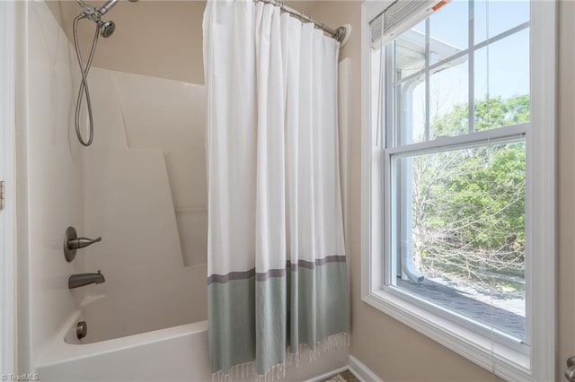 full bath with plenty of natural light and shower / bath combination with curtain