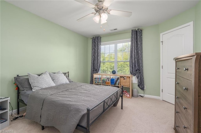 bedroom featuring carpet floors, baseboards, and a ceiling fan