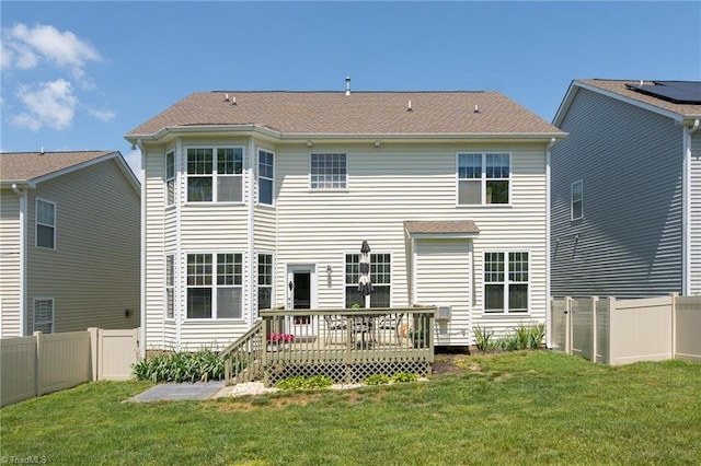 back of property featuring a wooden deck