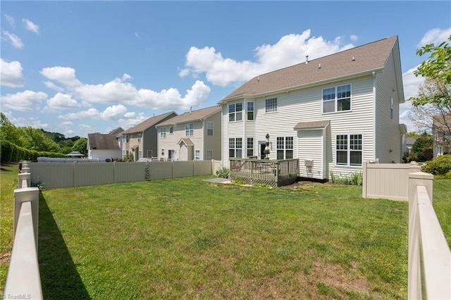 back of property with a deck and a residential view