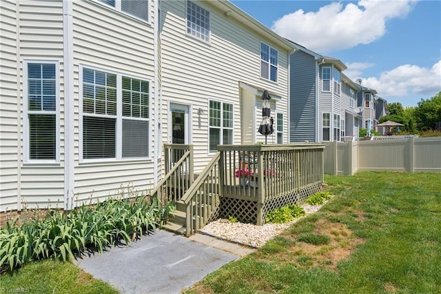 back of property with a deck