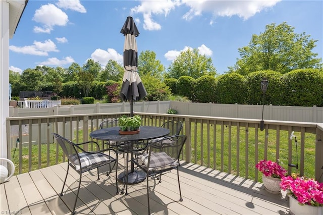 wooden deck with outdoor dining space