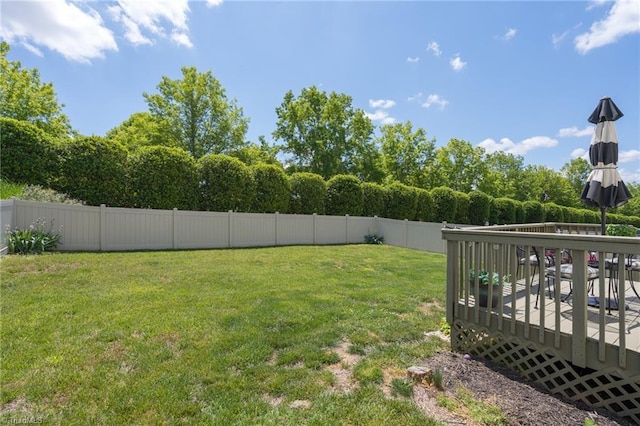 view of yard with a wooden deck