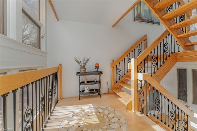 stairs featuring hardwood / wood-style flooring