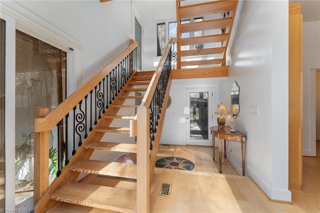 stairs featuring wood-type flooring