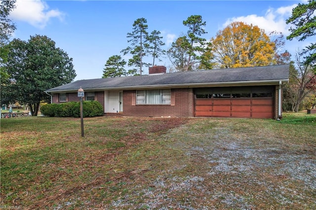 ranch-style home with a garage and a front yard