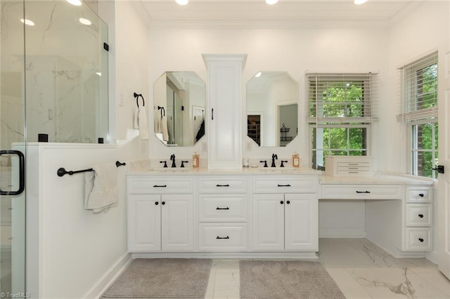 bathroom with a marble finish shower, crown molding, and a sink