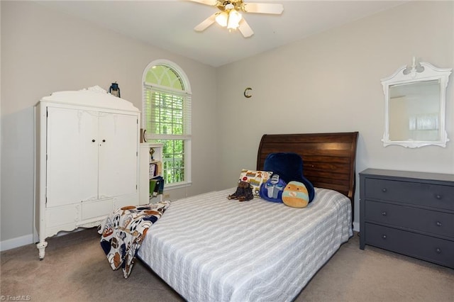 bedroom with ceiling fan, carpet floors, and baseboards