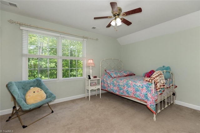 carpeted bedroom featuring baseboards, ceiling fan, and visible vents