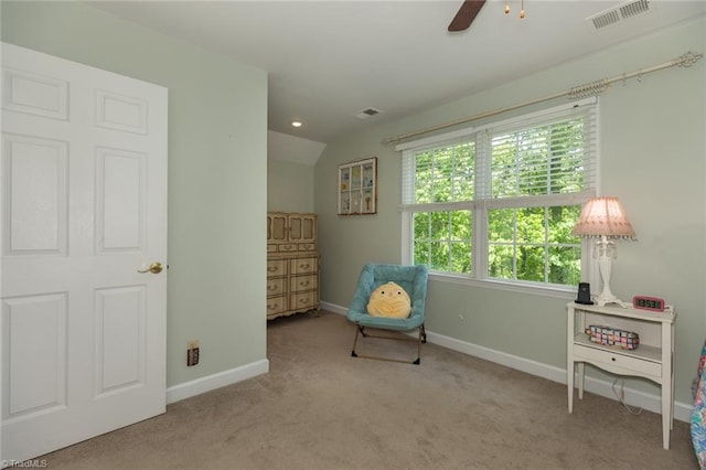 sitting room with carpet flooring, visible vents, baseboards, and ceiling fan